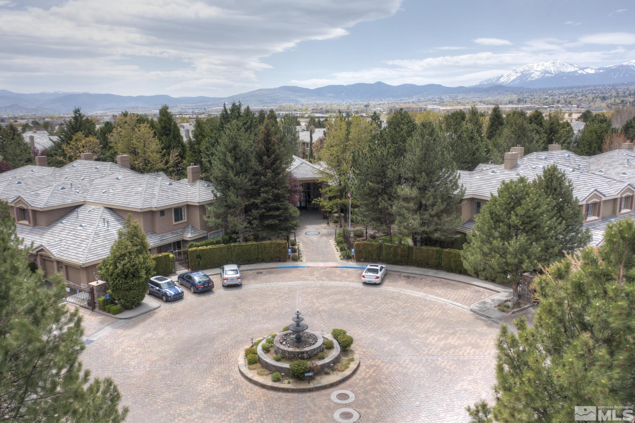 900 S Meadows, Unit 613 Reno, NV 89521 - Photo 39 of 40 an aerial view of a house with yard green space and mountain view in back