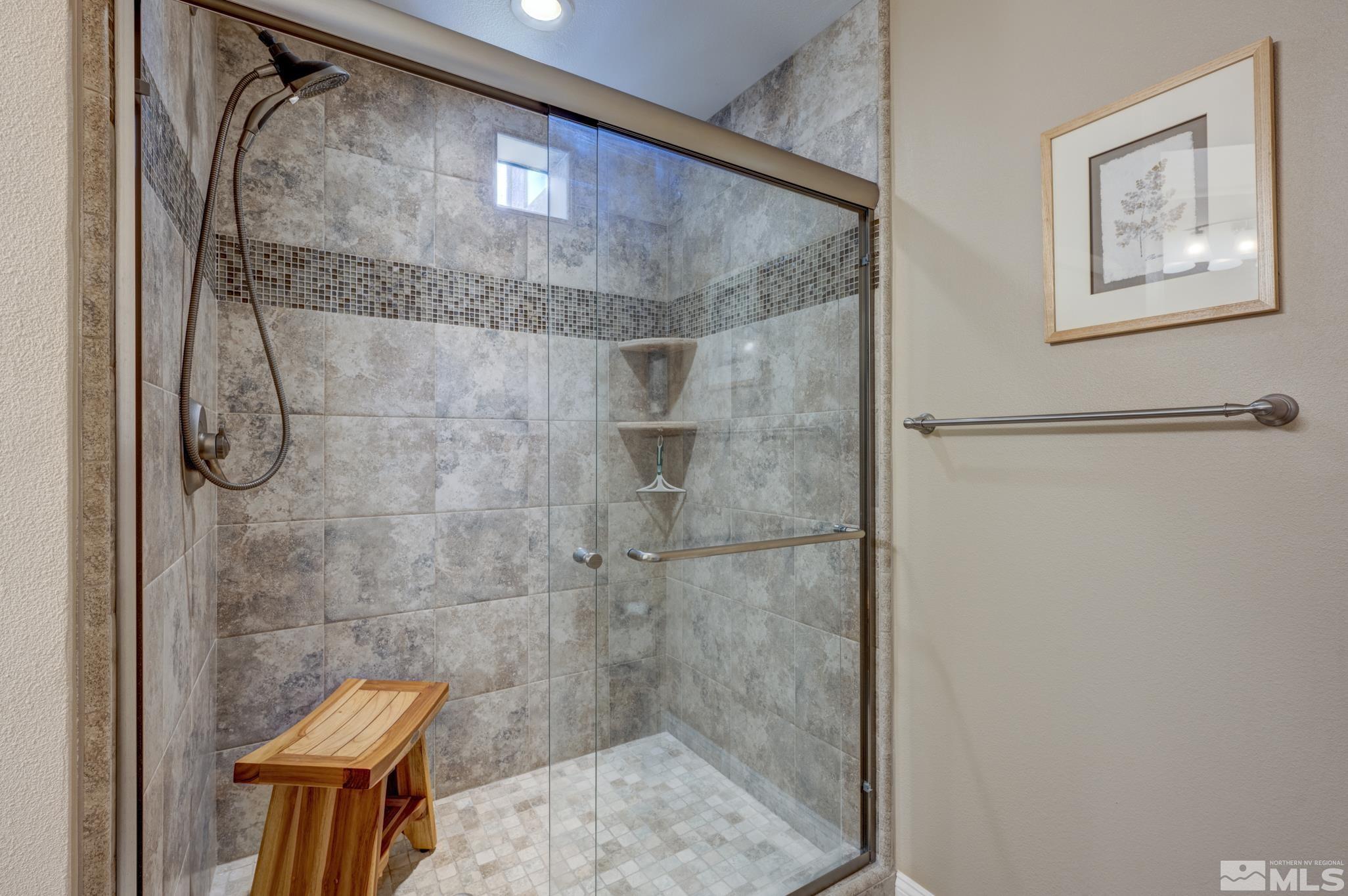 900 S Meadows, Unit 613 Reno, NV 89521 - Photo 4 of 40 a bathroom with a shower