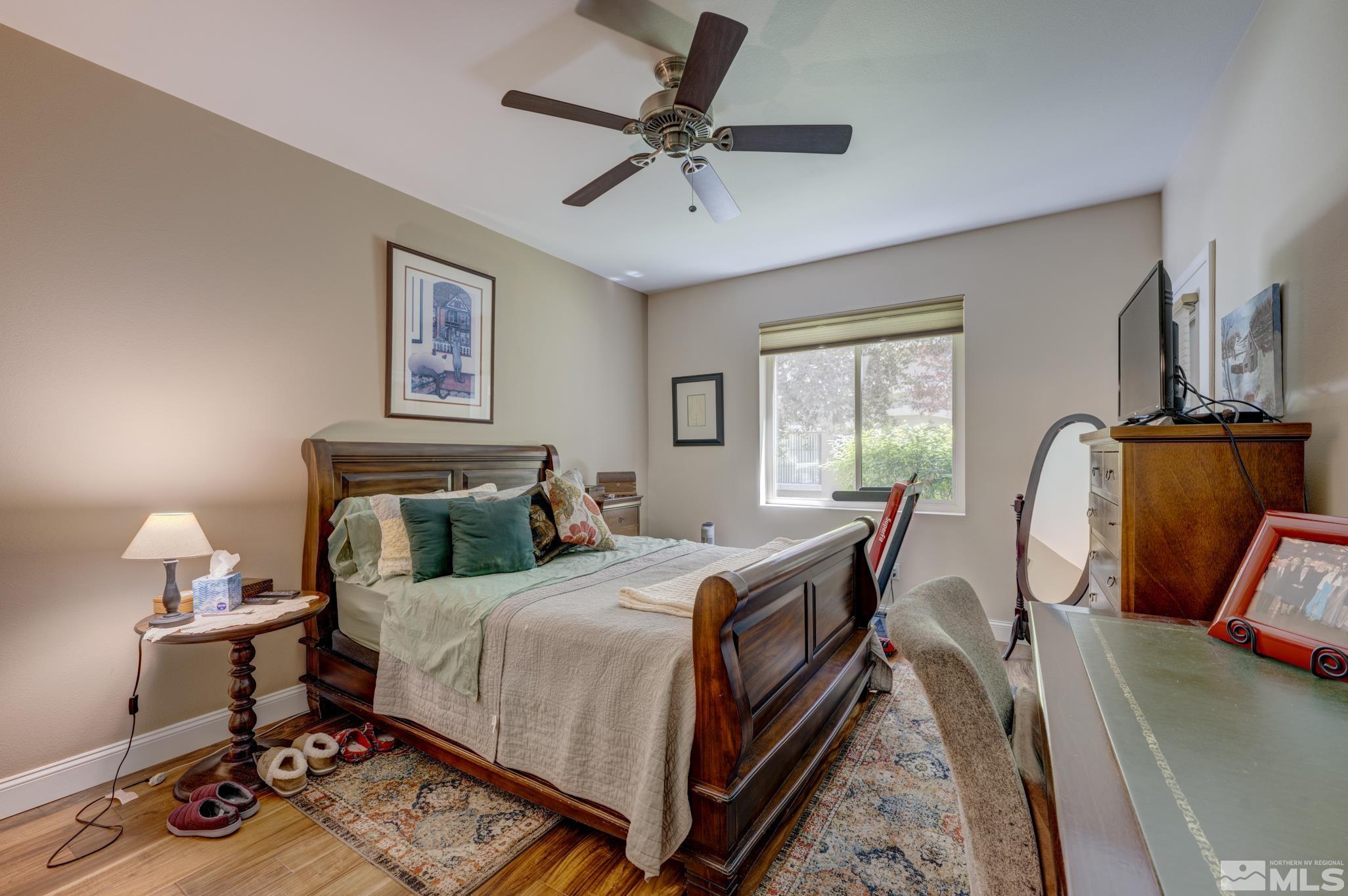 900 S Meadows, Unit 613 Reno, NV 89521 - Photo 5 of 40 a bedroom with bed chair and window