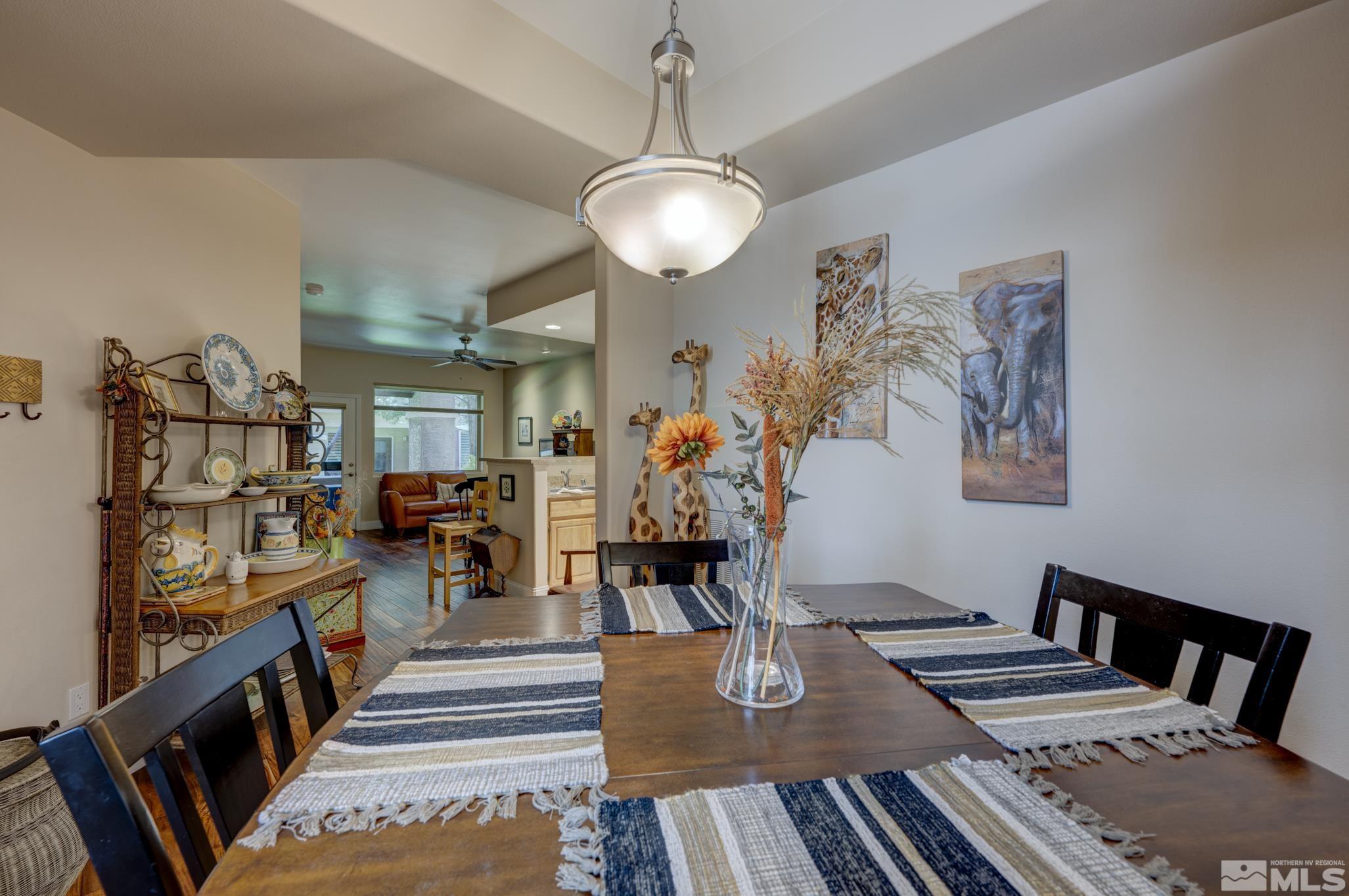 900 S Meadows, Unit 613 Reno, NV 89521 - Photo 10 of 40 a view of a dining room with furniture and wooden floor
