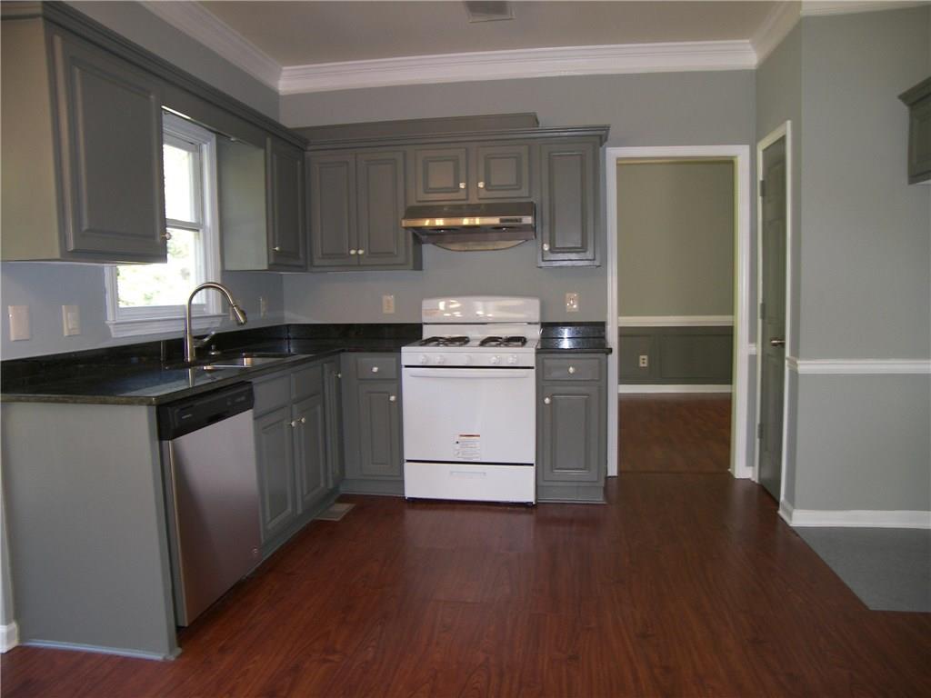 514 Rams Court Tucker, GA 30084 - Photo 5 of 14 a kitchen with a sink stove and cabinets