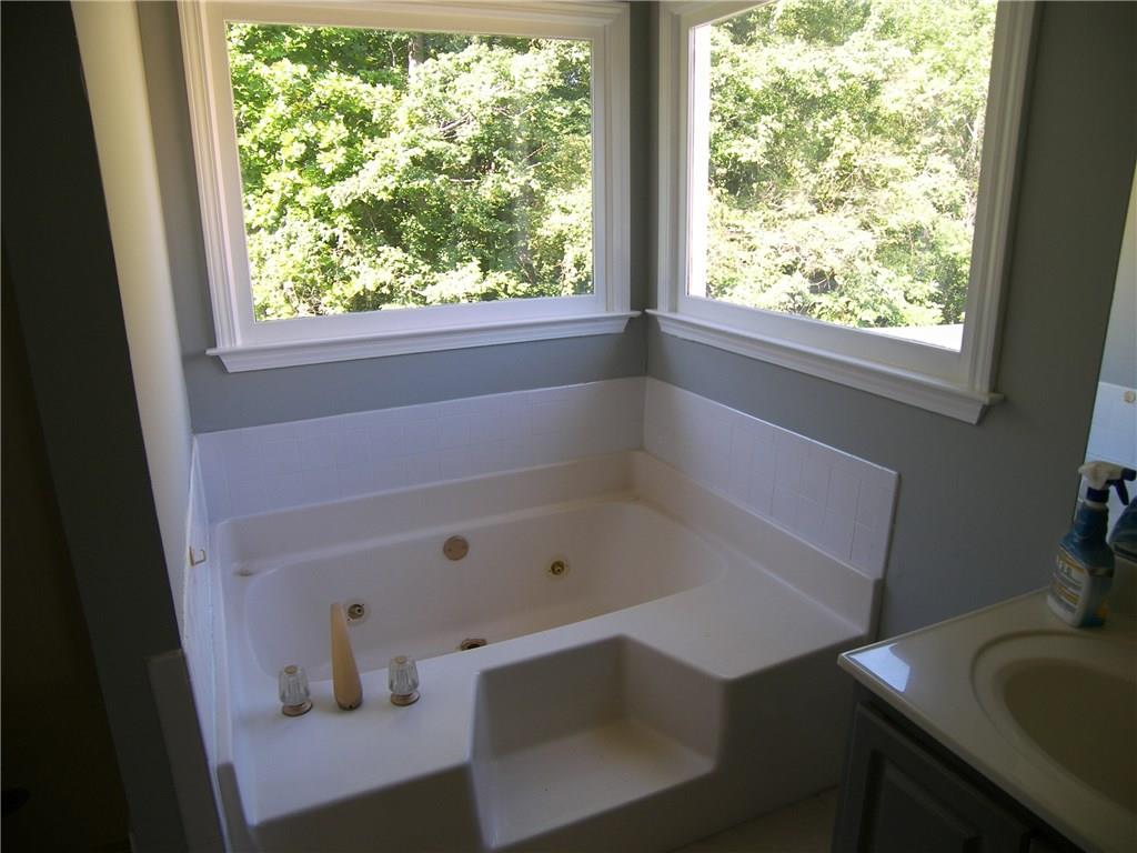 514 Rams Court Tucker, GA 30084 - Photo 9 of 14 a bathroom with a sink and a bathtub