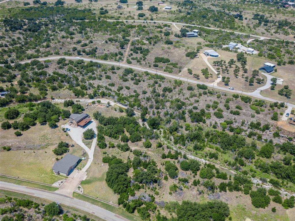 8021 Hells Gate Loop Strawn, TX 76475 - Photo 19 of 39 an aerial view of residential houses with outdoor space