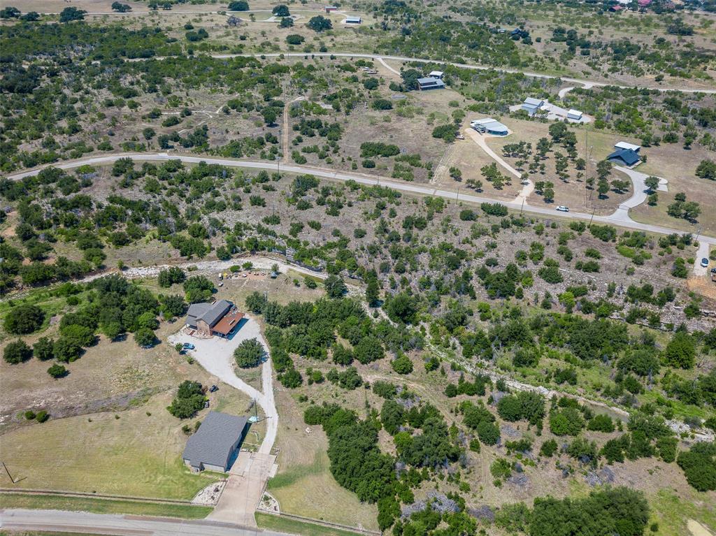 8021 Hells Gate Loop Strawn, TX 76475 - Photo 20 of 39 an aerial view of residential houses with outdoor space