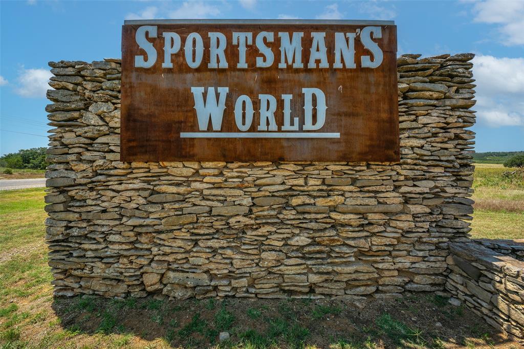 8021 Hells Gate Loop Strawn, TX 76475 - Photo 2 of 39 a sign on the side of building