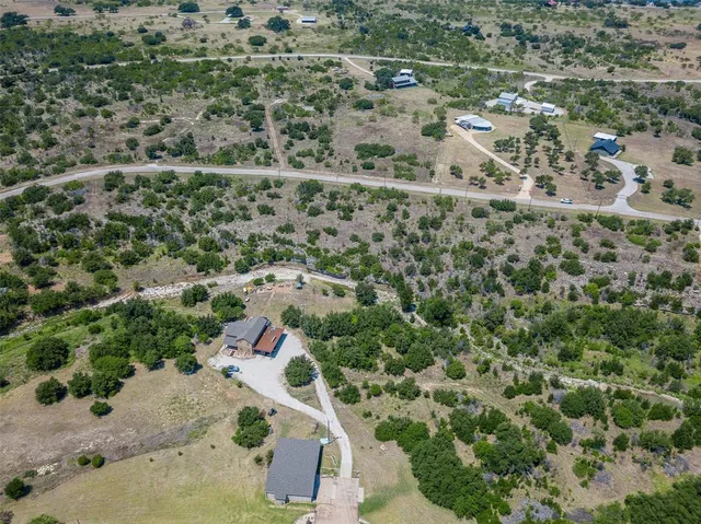 an aerial view of residential house with outdoor space