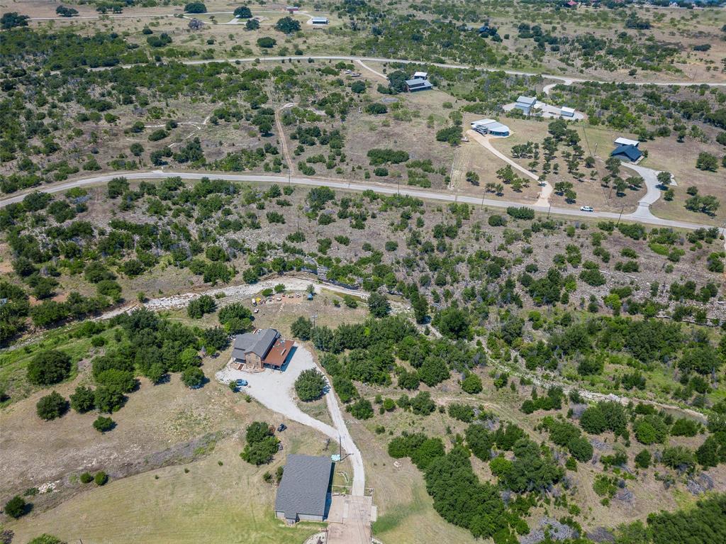 8021 Hells Gate Loop Strawn, TX 76475 - Photo 21 of 39 an aerial view of residential house with outdoor space