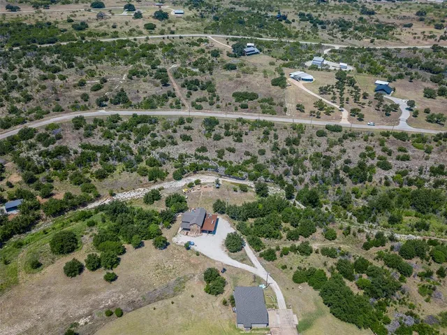 an aerial view of residential house with outdoor space
