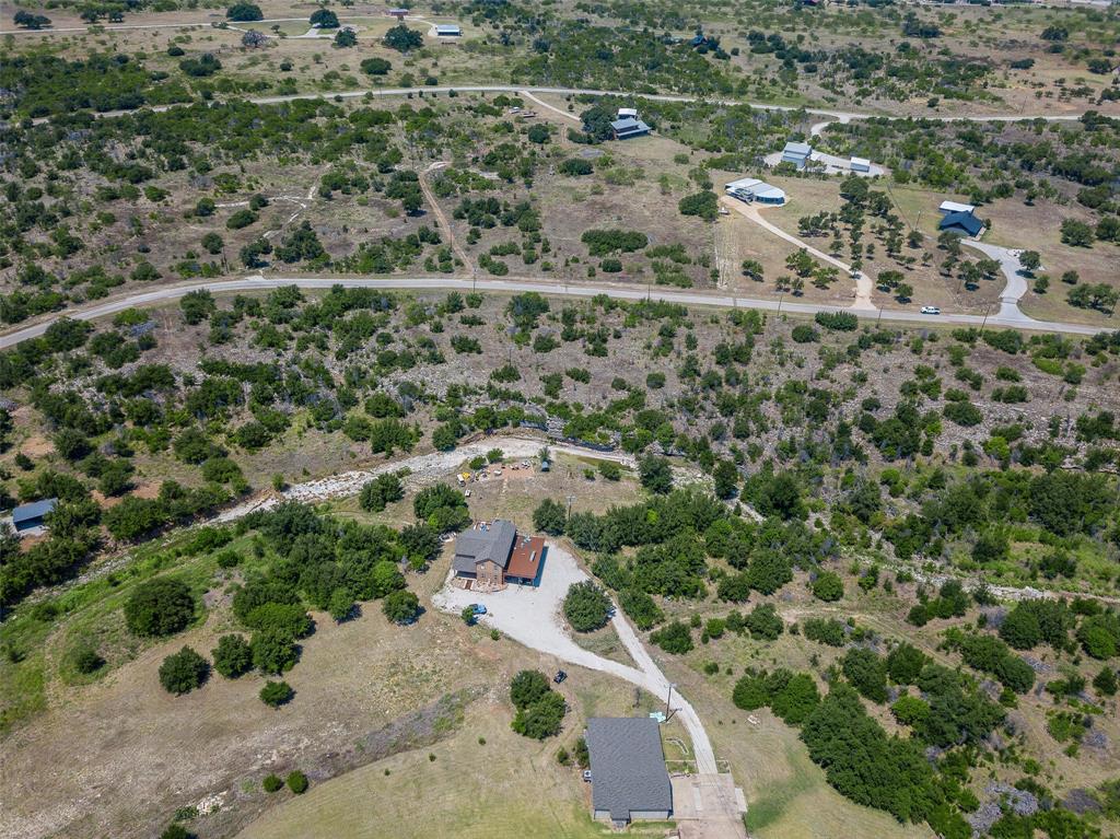 8021 Hells Gate Loop Strawn, TX 76475 - Photo 22 of 39 an aerial view of residential house with outdoor space