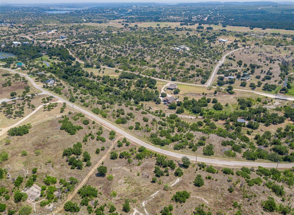 8021 Hells Gate Loop Strawn, TX 76475 - Photo 36 of 39 an aerial view of a house with a yard