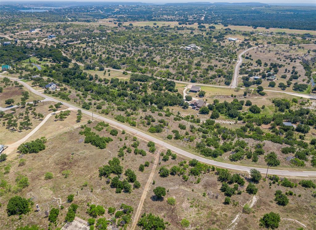 8021 Hells Gate Loop Strawn, TX 76475 - Photo 37 of 39 an aerial view of a house with a yard