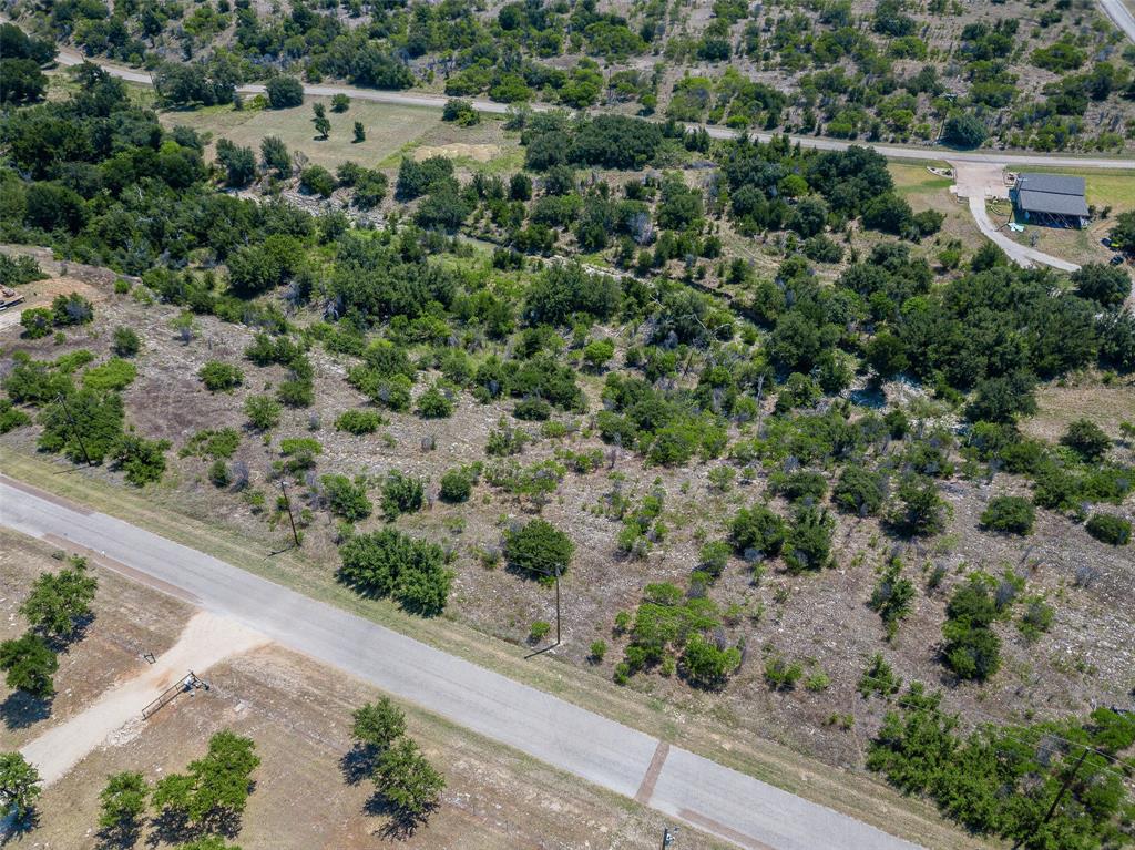 8021 Hells Gate Loop Strawn, TX 76475 - Photo 39 of 39 an aerial view of a house with a yard