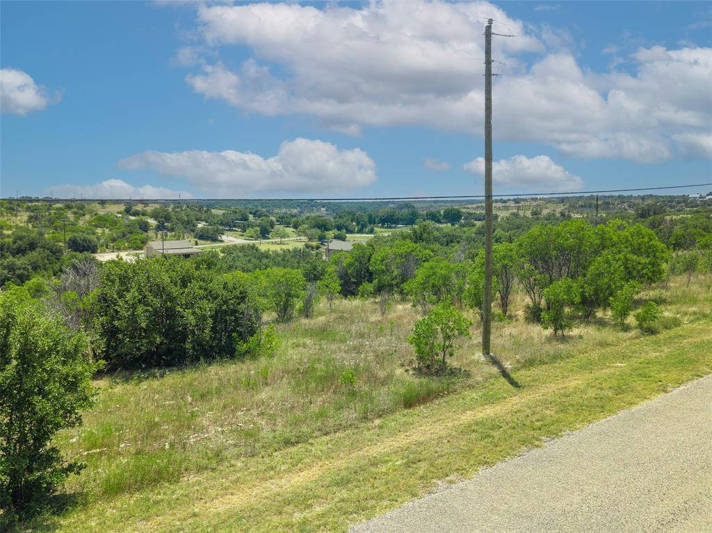 8021 Hells Gate Loop Strawn, TX 76475 - Photo 6 of 39 a view of a garden with a building