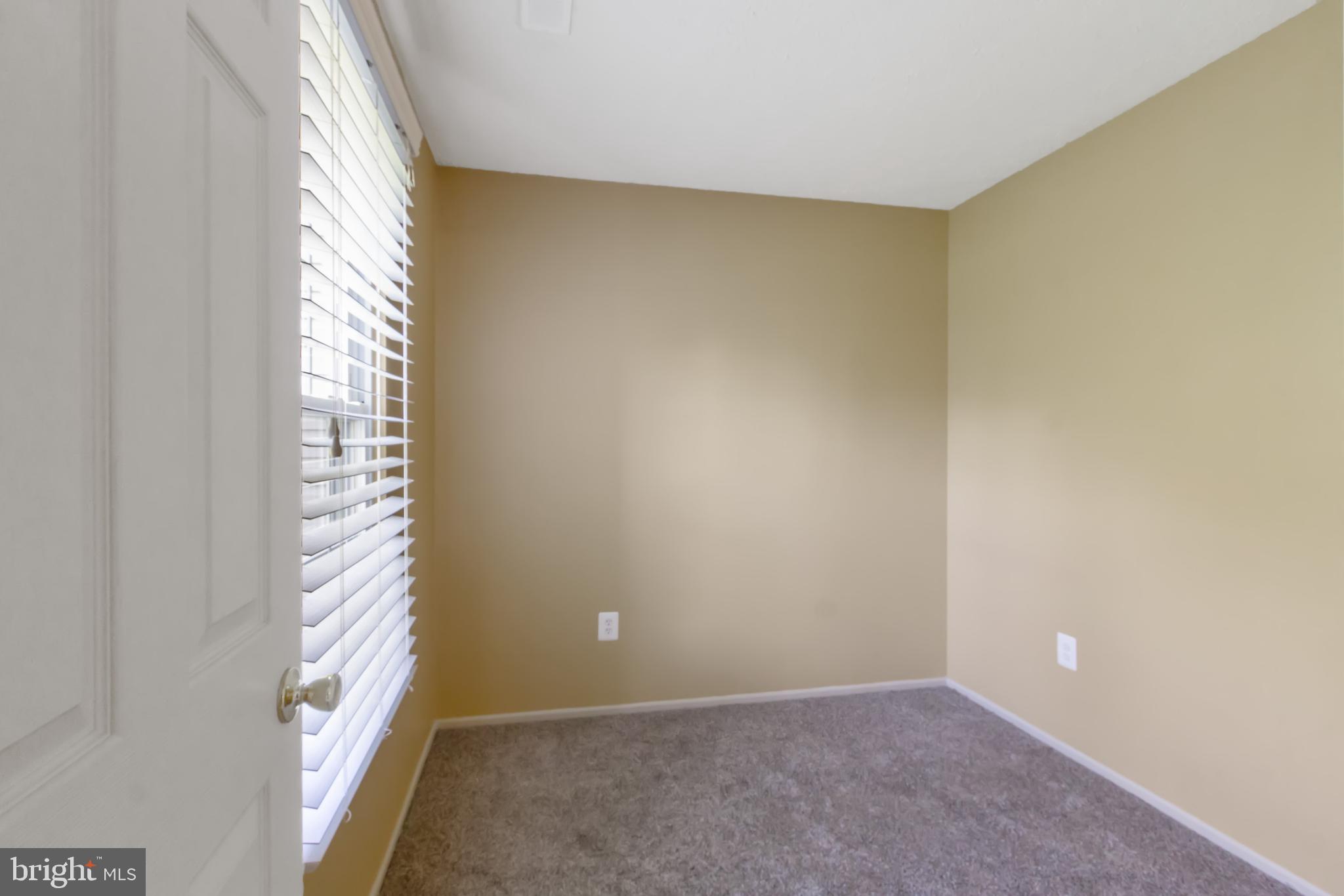 96 Jumpers Circle, Unit 216 Baltimore, MD 21236 - Photo 10 of 29 a view of an empty room with a window