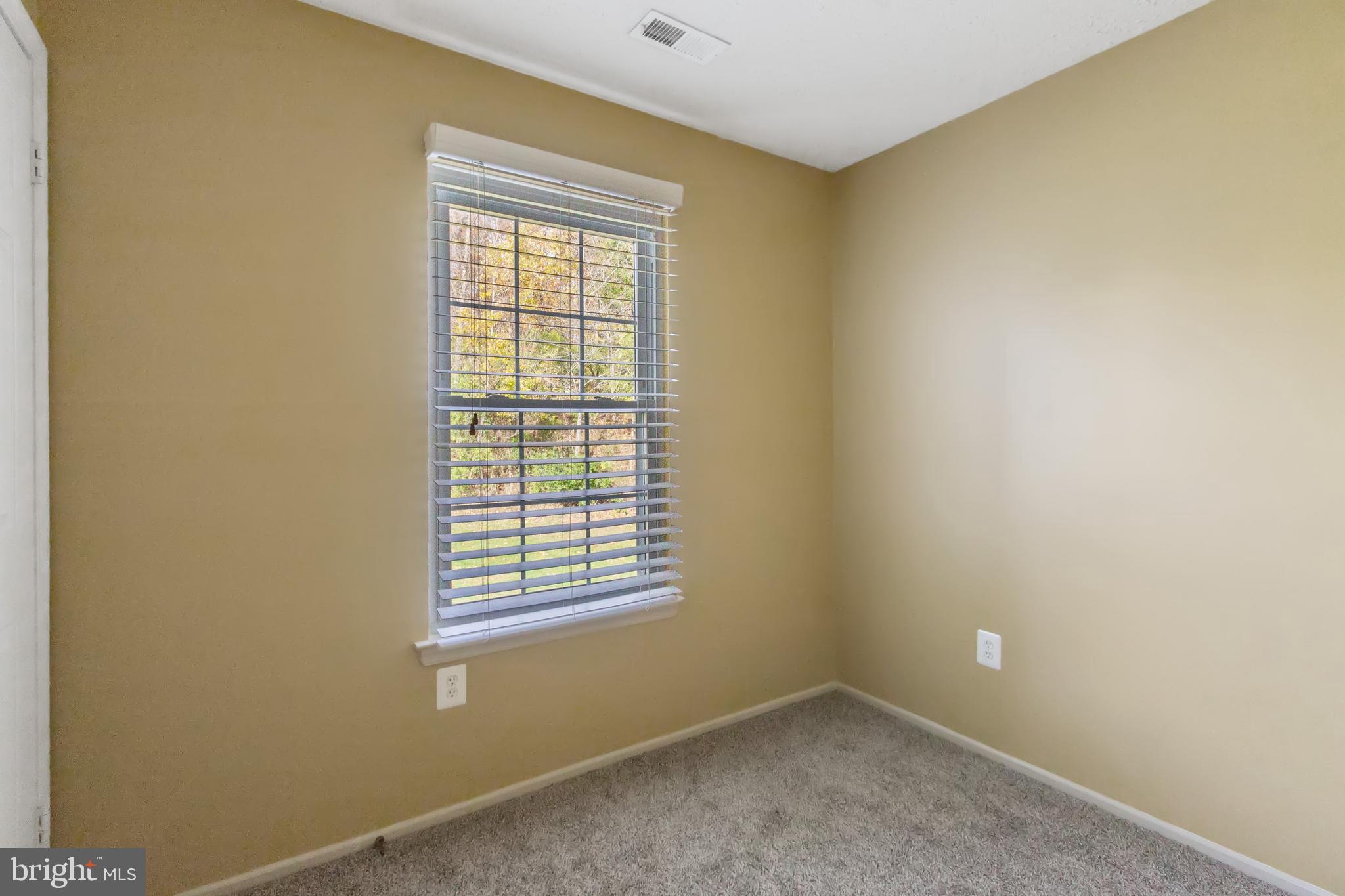 96 Jumpers Circle, Unit 216 Baltimore, MD 21236 - Photo 11 of 29 an empty room with a window
