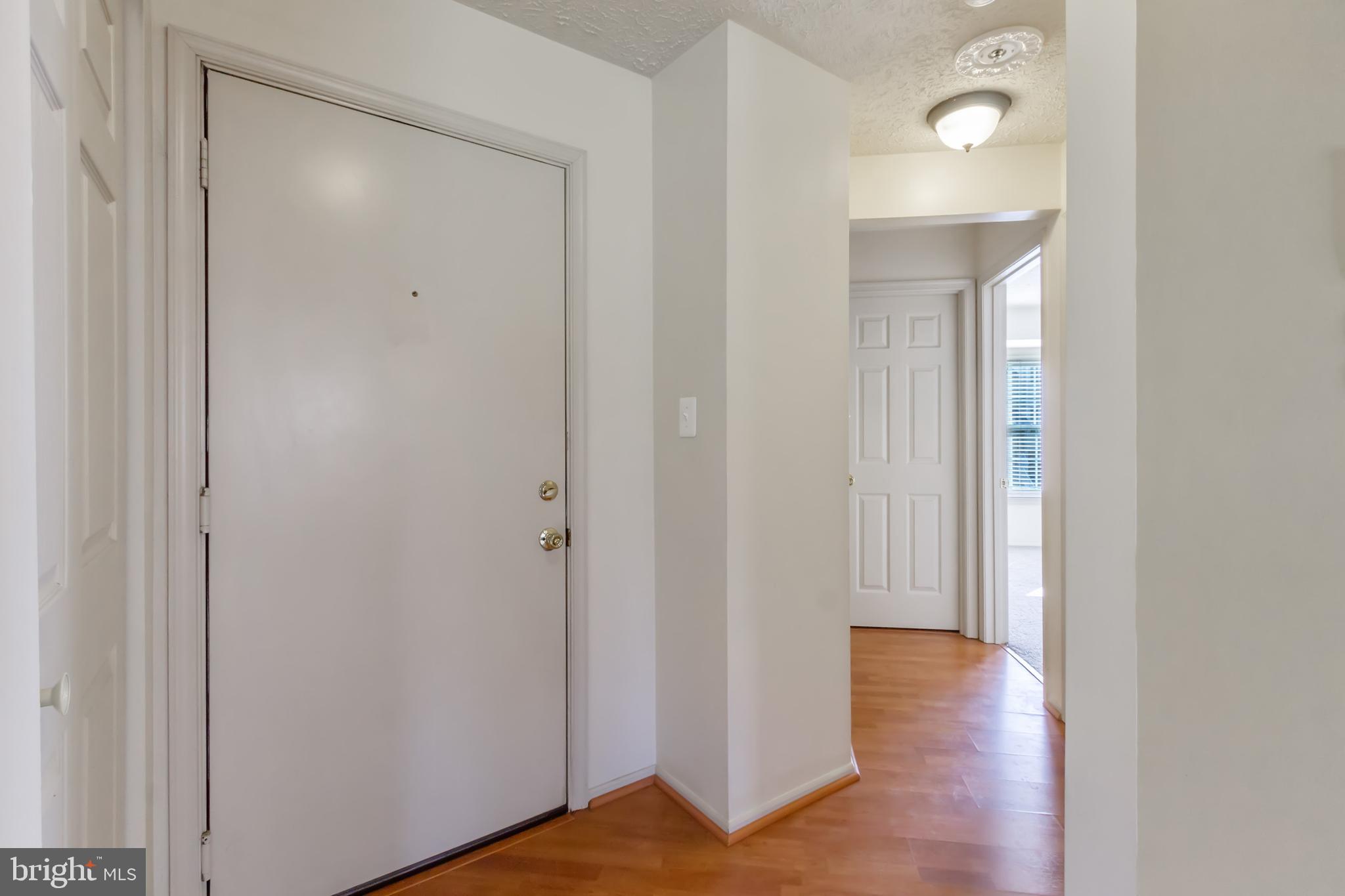 96 Jumpers Circle, Unit 216 Baltimore, MD 21236 - Photo 12 of 29 a view of a hallway with wooden floor