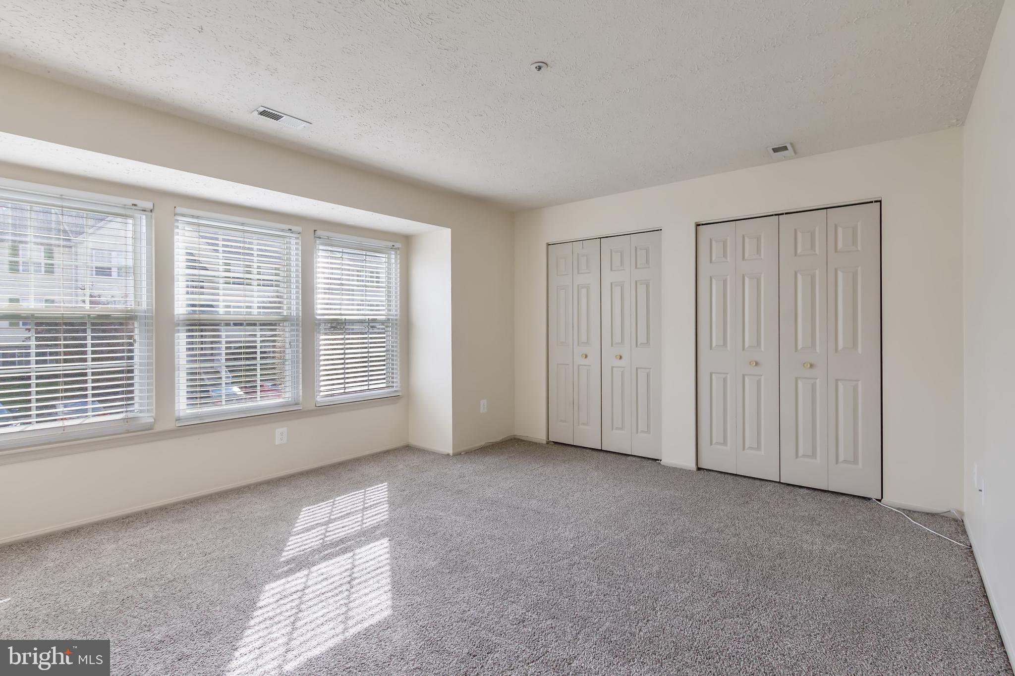 96 Jumpers Circle, Unit 216 Baltimore, MD 21236 - Photo 14 of 29 a view of an empty room with a window