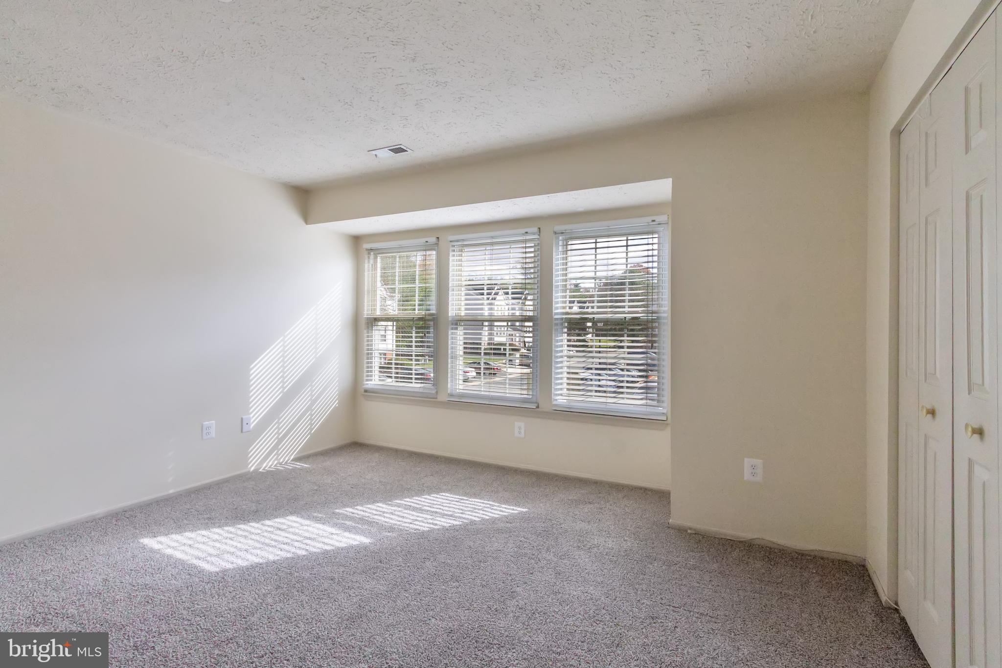 96 Jumpers Circle, Unit 216 Baltimore, MD 21236 - Photo 15 of 29 a view of an empty room with a window
