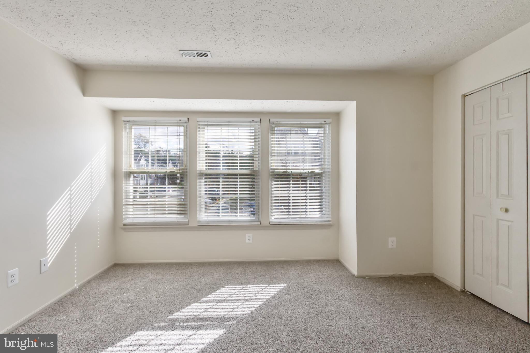 96 Jumpers Circle, Unit 216 Baltimore, MD 21236 - Photo 17 of 29 a view of an empty room with a window