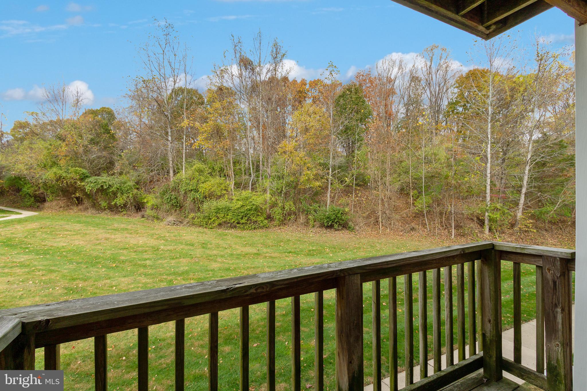 96 Jumpers Circle, Unit 216 Baltimore, MD 21236 - Photo 19 of 29 a view of a balcony with an outdoor space and seating