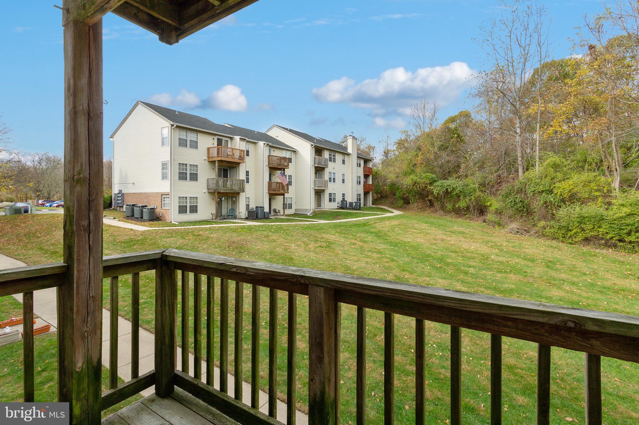 96 Jumpers Circle, Unit 216 Baltimore, MD 21236 - Photo 20 of 29 a view of a balcony with yard