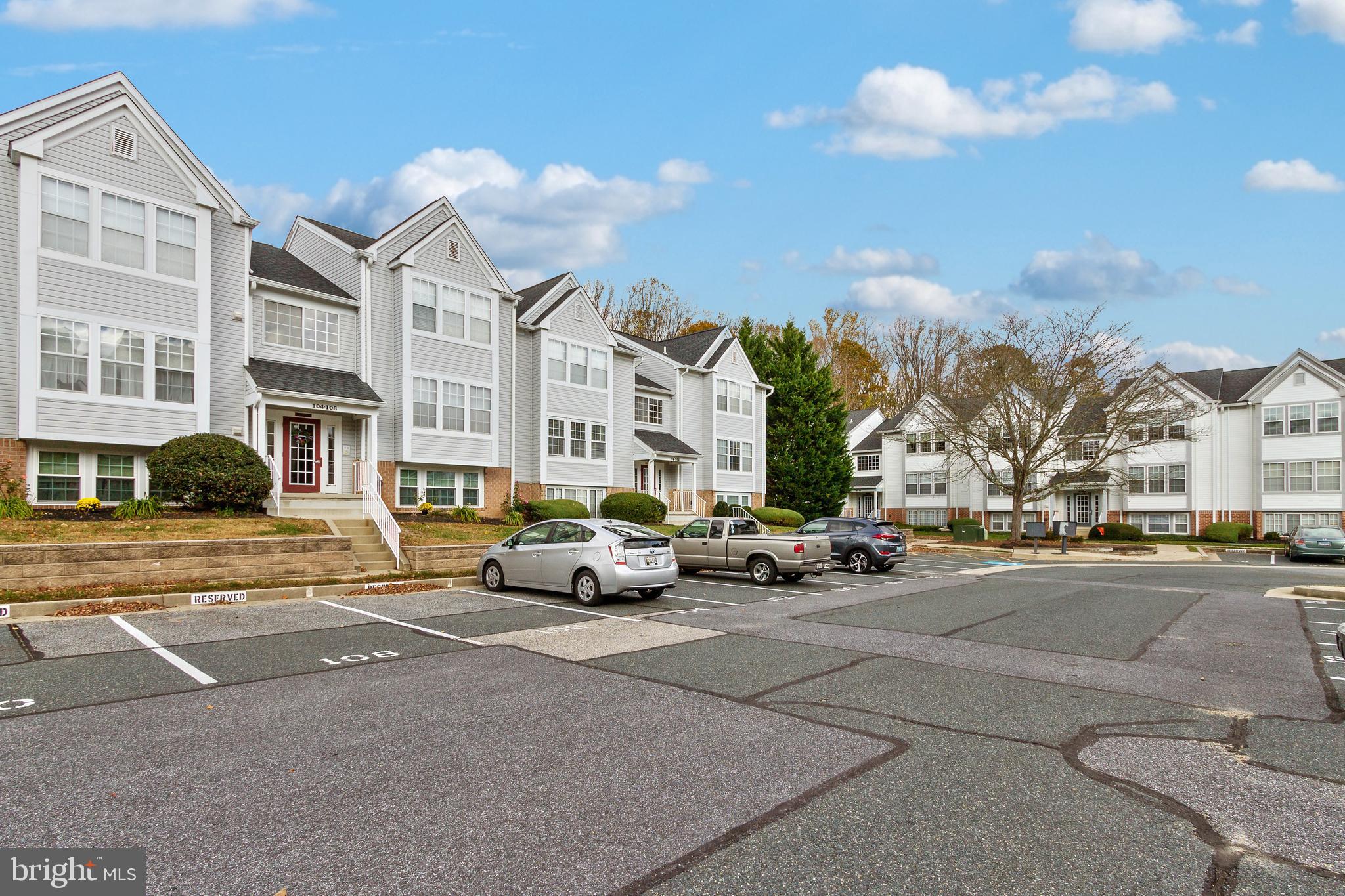 96 Jumpers Circle, Unit 216 Baltimore, MD 21236 - Photo 24 of 29 a city street lined with buildings and cars