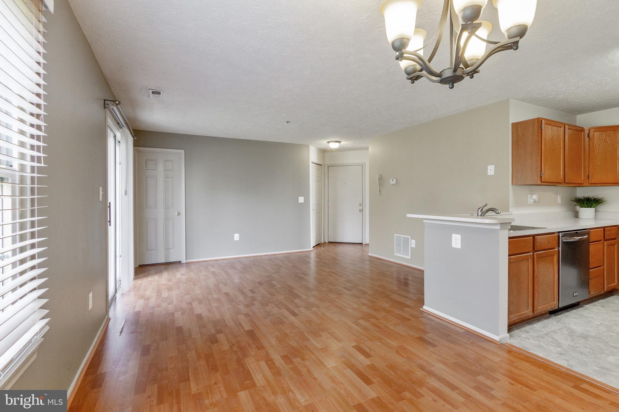 96 Jumpers Circle, Unit 216 Baltimore, MD 21236 - Photo 5 of 29 a view of a kitchen with a sink and dishwasher wooden floor
