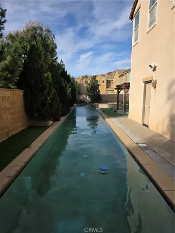a view of a backyard with sitting area
