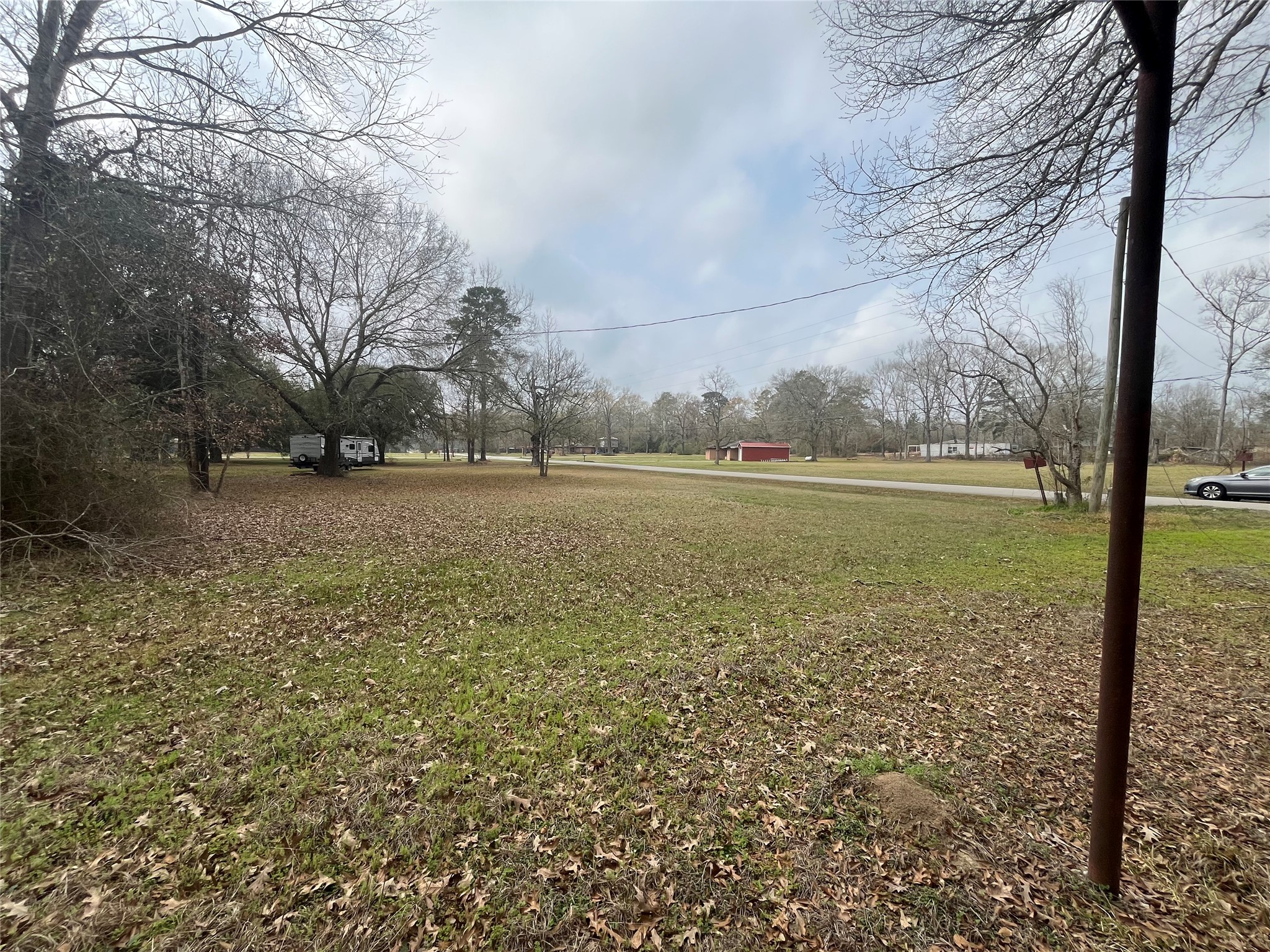 48 Magnolia Road New Caney, TX 77357 - Photo 10 of 12 a view of a yard with an tree