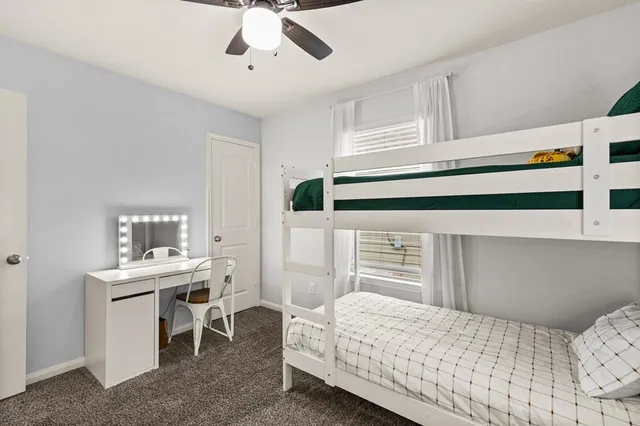 a bedroom with a bed and a table