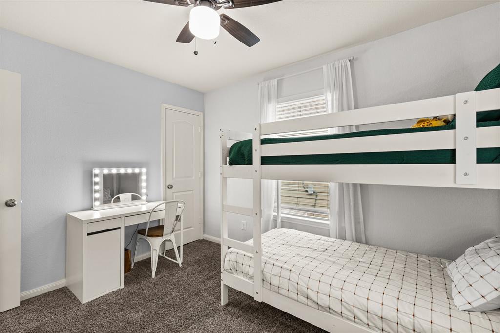 10237 Omni Drive Waco, TX 76708 - Photo 12 of 40 a bedroom with a bed and a table