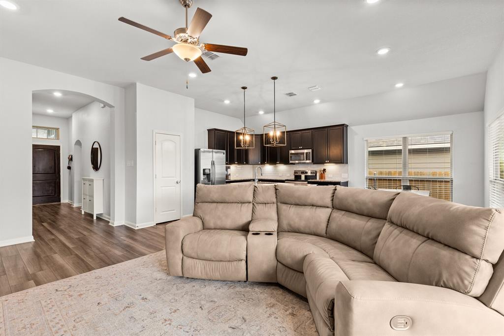 10237 Omni Drive Waco, TX 76708 - Photo 21 of 40 a living room filled with furniture and kitchen view
