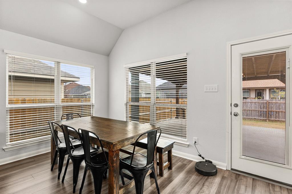 10237 Omni Drive Waco, TX 76708 - Photo 29 of 40 a view of a dining room with furniture and wooden floor