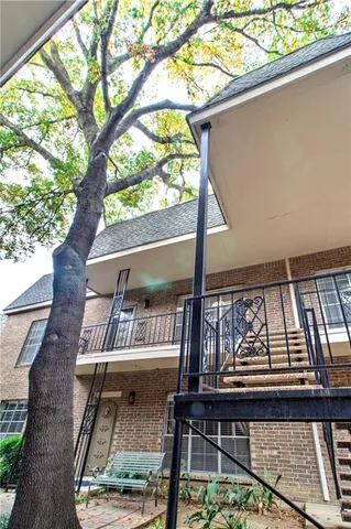 a view of a balcony with wooden floor