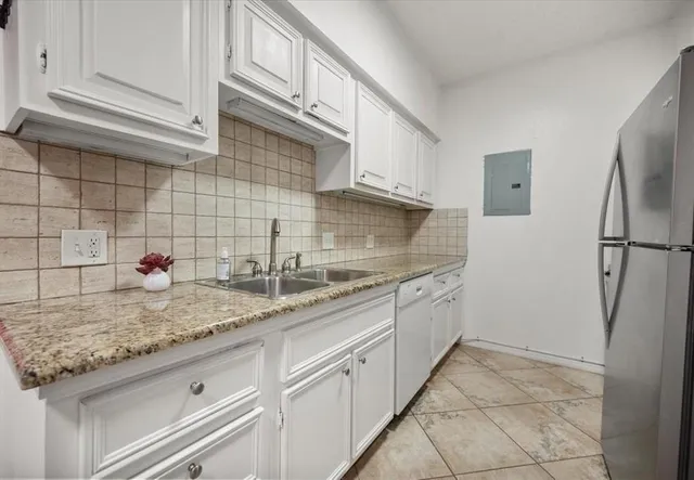 a kitchen with a sink and cabinets