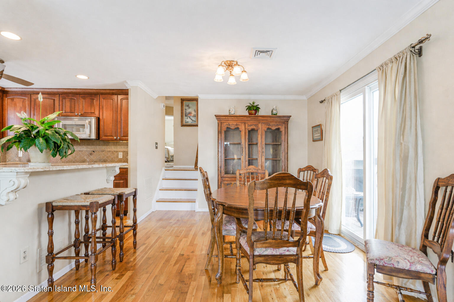 76 Berry Avenue Staten Island, NY 10312 - Photo 8 of 42 a view of a dining room with furniture and a livingroom