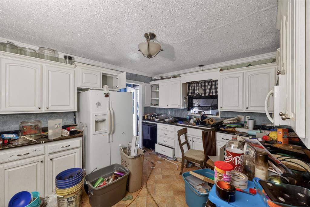 801 North Main Street Dodd City, TX 75438 - Photo 16 of 31 a kitchen with a refrigerator and a stove top oven