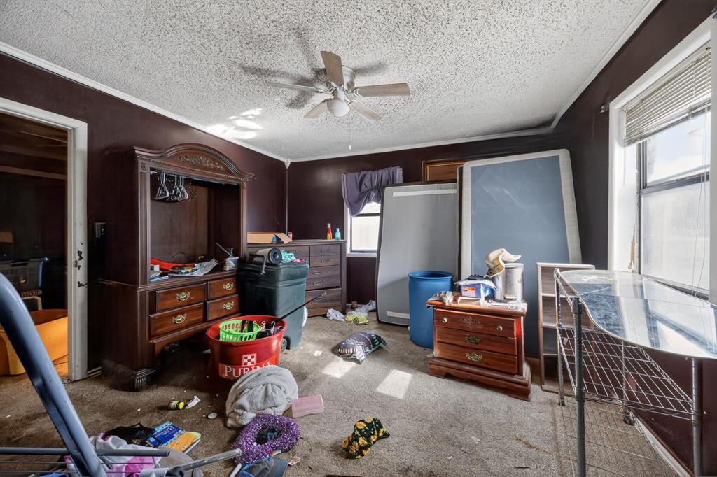 801 North Main Street Dodd City, TX 75438 - Photo 24 of 31 a living room with lots of furniture and a flat screen tv