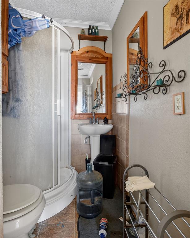 801 North Main Street Dodd City, TX 75438 - Photo 26 of 31 a bathroom with a sink toilet and shower