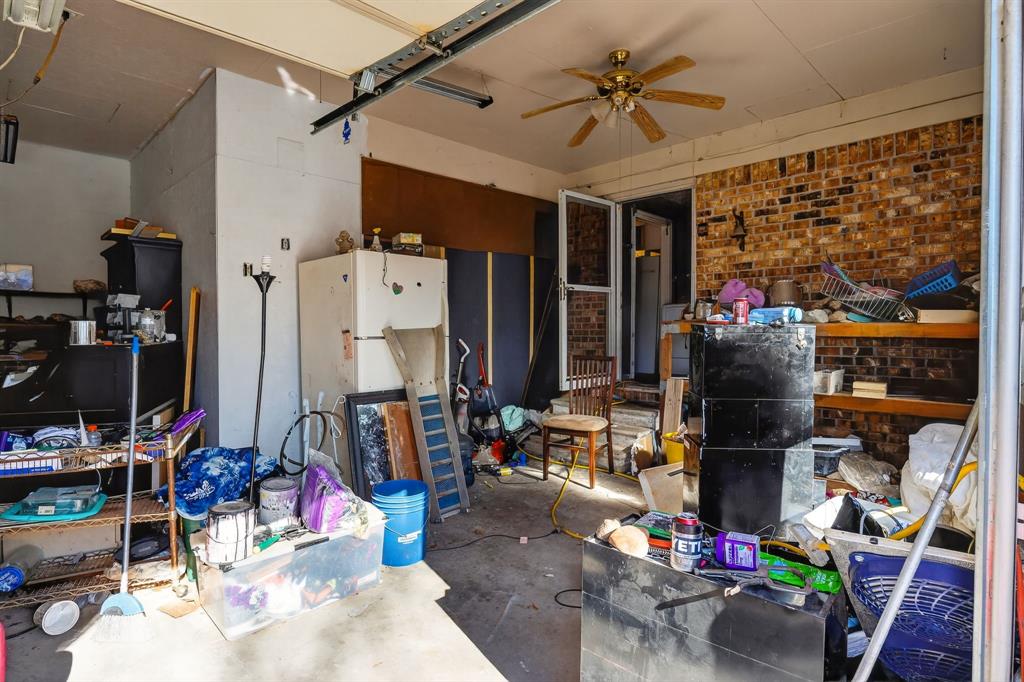 801 North Main Street Dodd City, TX 75438 - Photo 3 of 31 a view of a storage room with washer and dryer