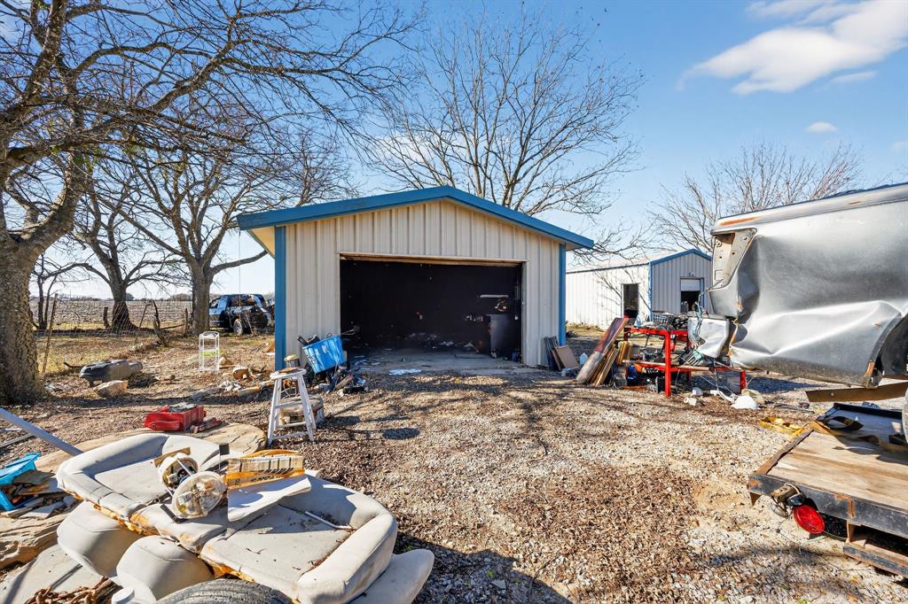 801 North Main Street Dodd City, TX 75438 - Photo 10 of 31 a view of a chairs and table in front of house