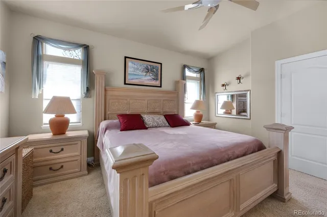 a bathroom with a granite countertop sink a large mirror and a bathtub