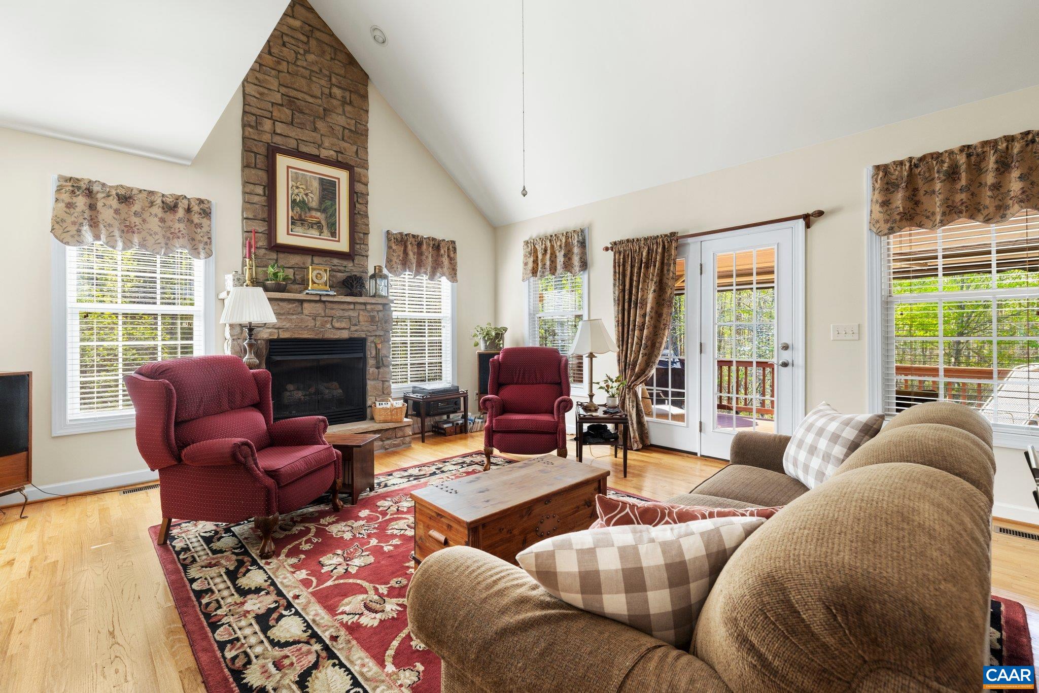 5437 3 Notch Road Louisa, VA 23093 - Photo 16 of 35 a living room with furniture fireplace and a large window