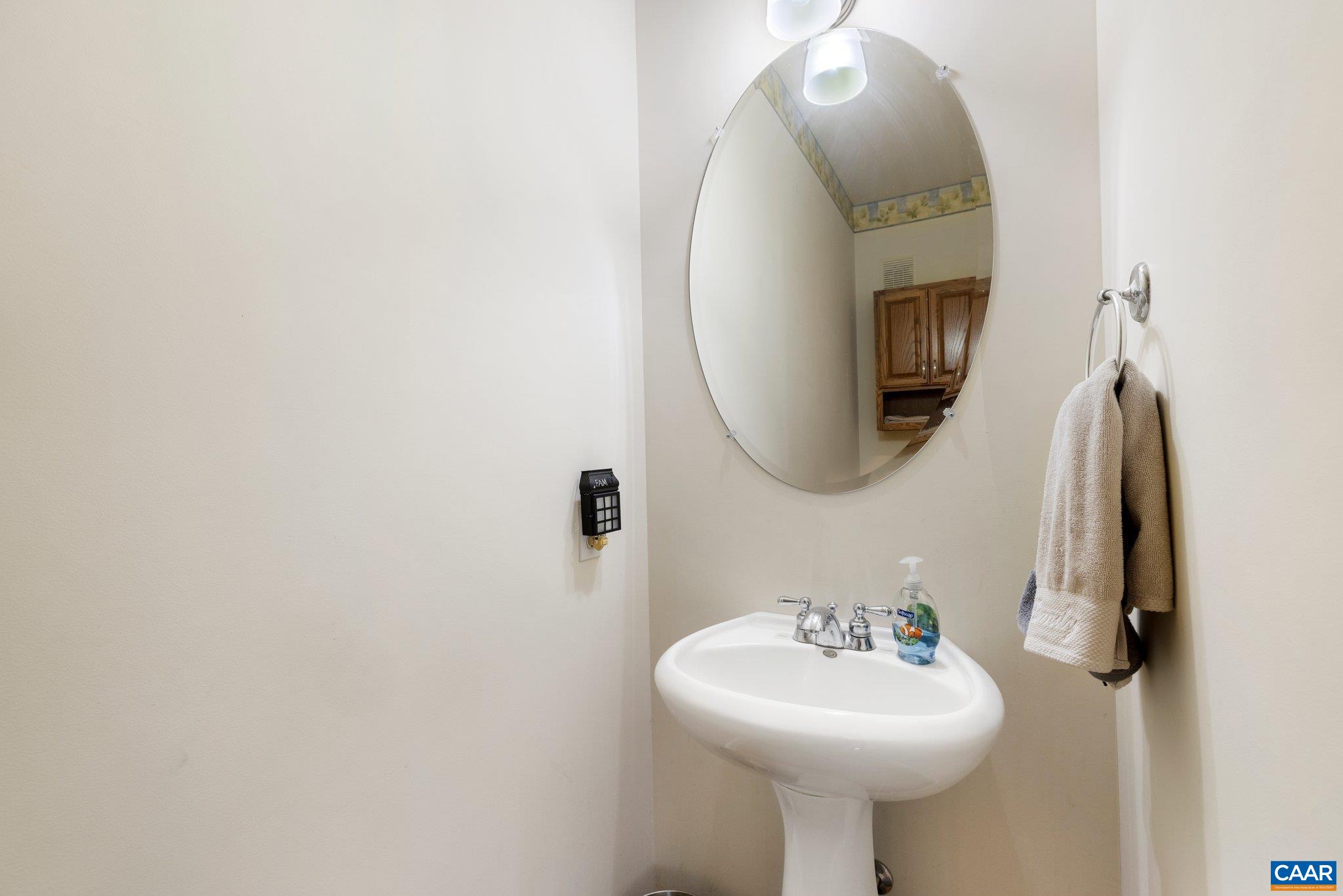 5437 3 Notch Road Louisa, VA 23093 - Photo 26 of 35 a bathroom with a sink a mirror and a toilet