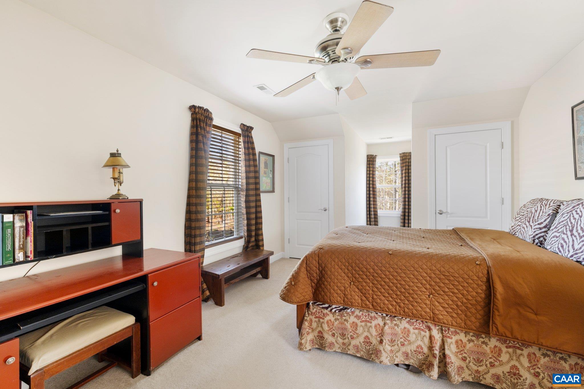 5437 3 Notch Road Louisa, VA 23093 - Photo 28 of 35 a bedroom with a bed and a chandelier