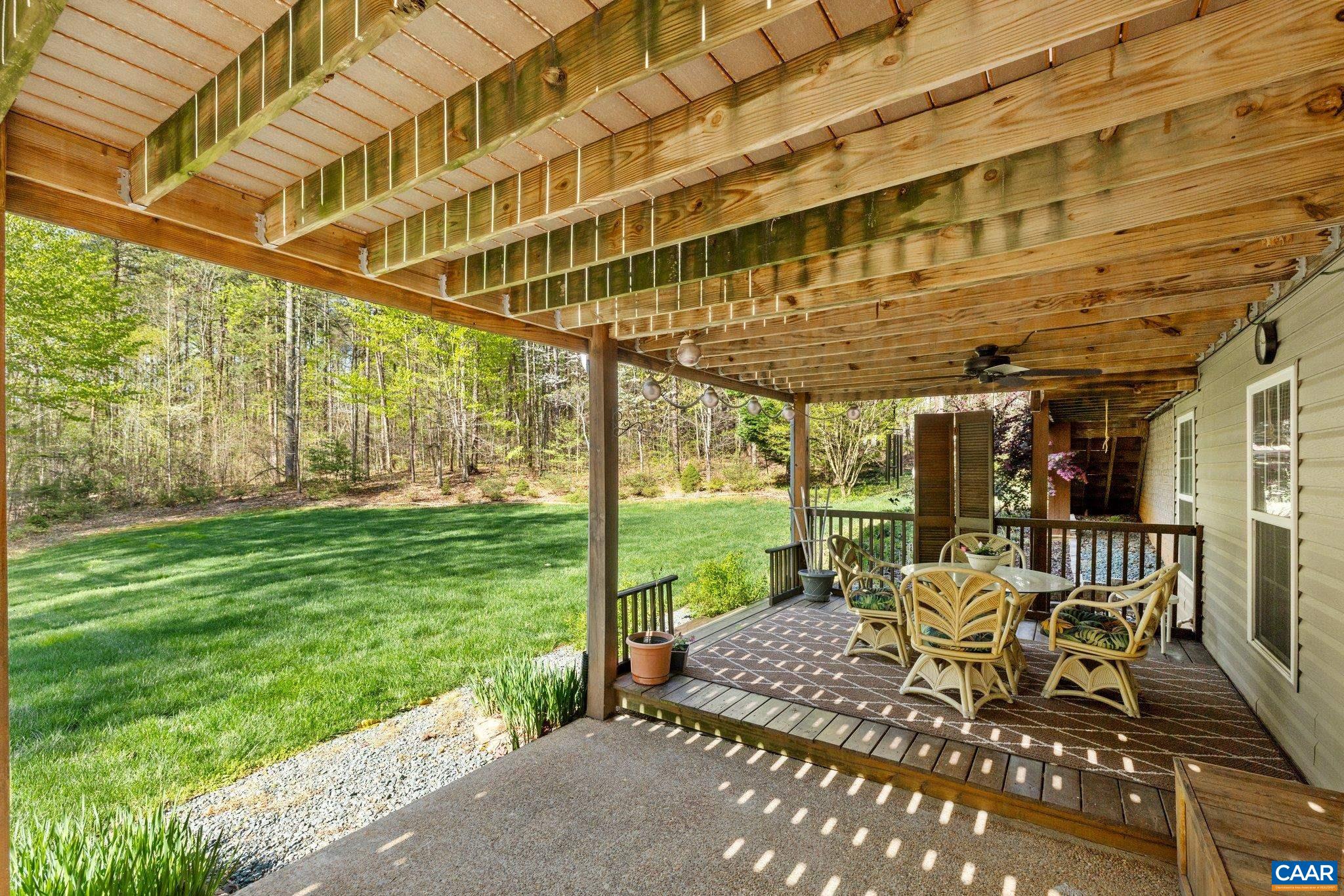 5437 3 Notch Road Louisa, VA 23093 - Photo 6 of 35 a patio with glass top table and chairs