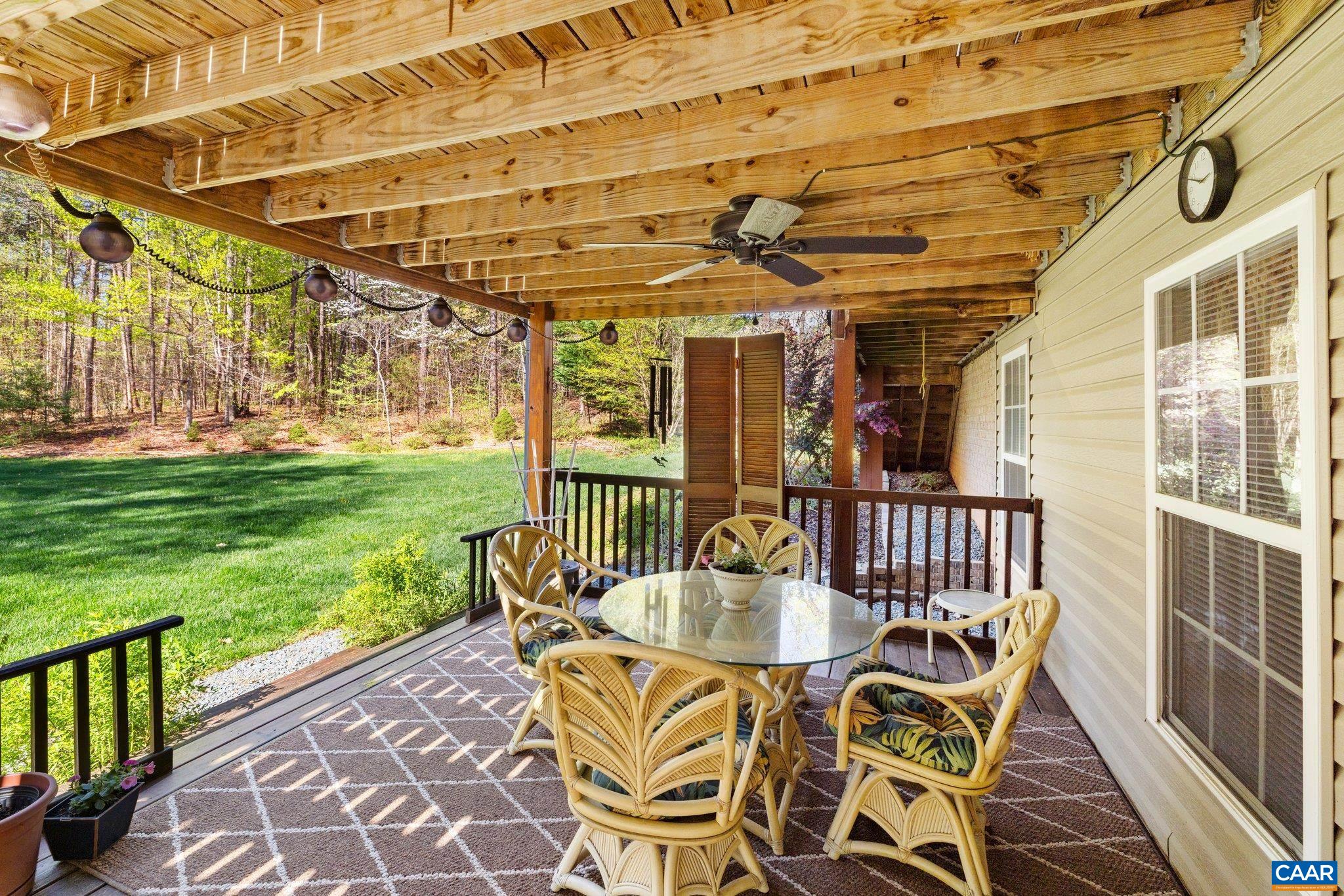 5437 3 Notch Road Louisa, VA 23093 - Photo 7 of 35 a view of a patio with a table and chairs