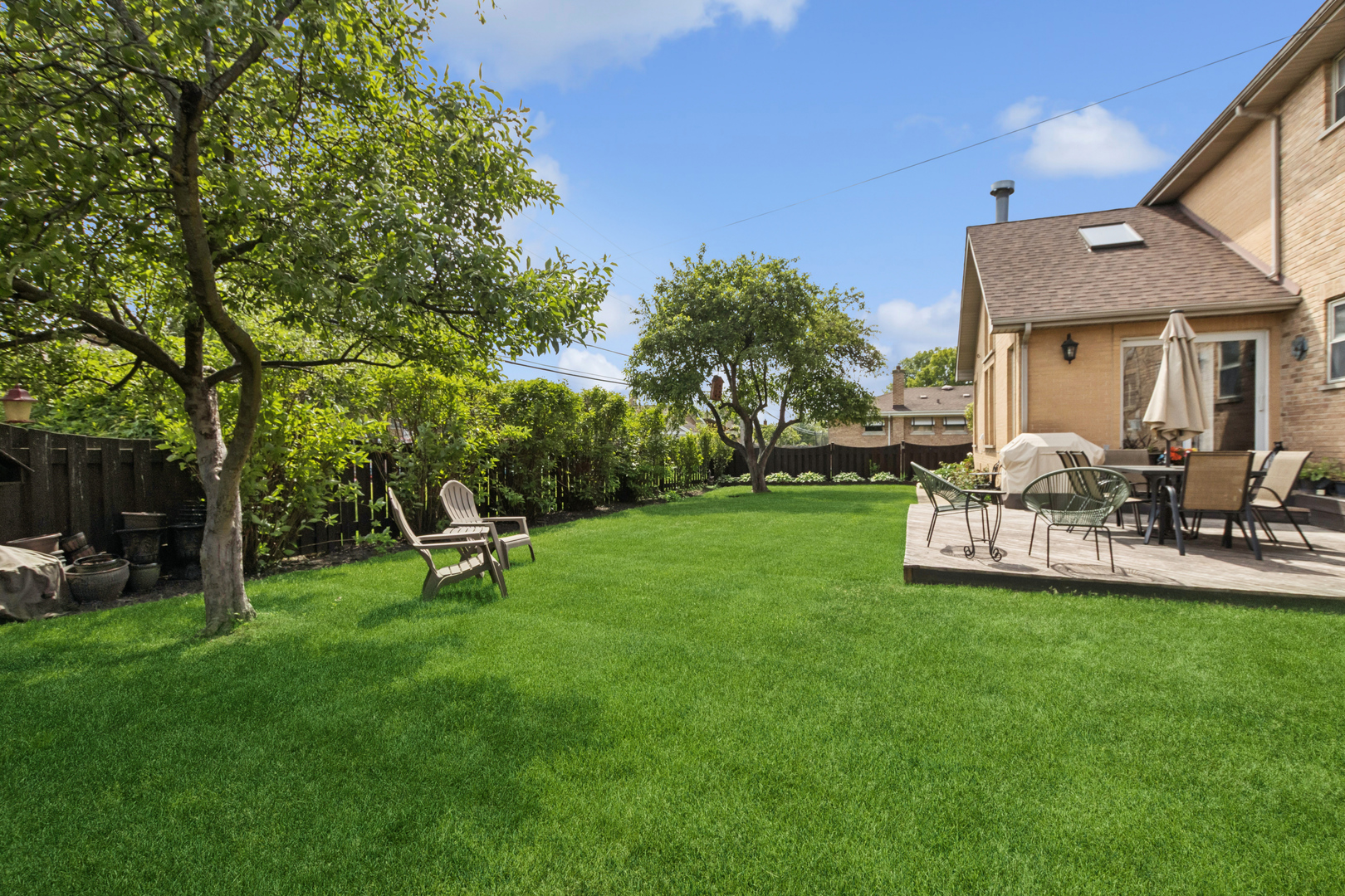 7911 West Rascher Avenue Chicago, IL 60656 - Photo 34 of 39 a view of a house with backyard and sitting area
