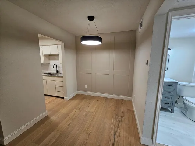 a view of a kitchen from the hallway