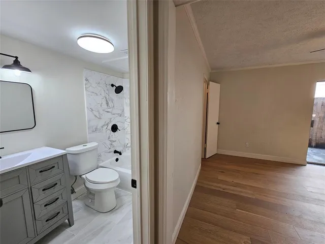 a bathroom with a toilet sink and a mirror